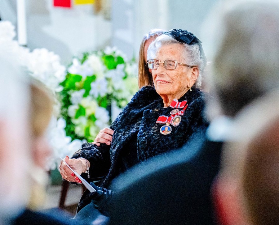 Princess Astrid sits dressed in black with her orders on her chest during the funeral service in Oslo Cathedral