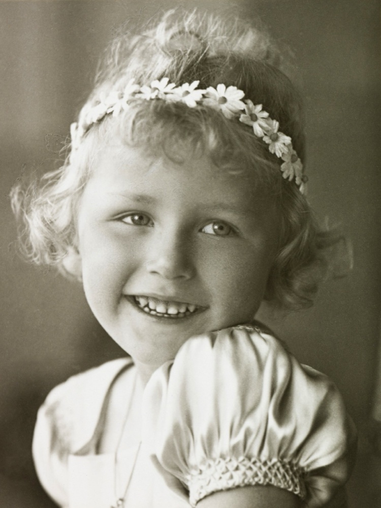 Princess Astrid as a small girl with a garland of flowers in her hair, black and white portrait