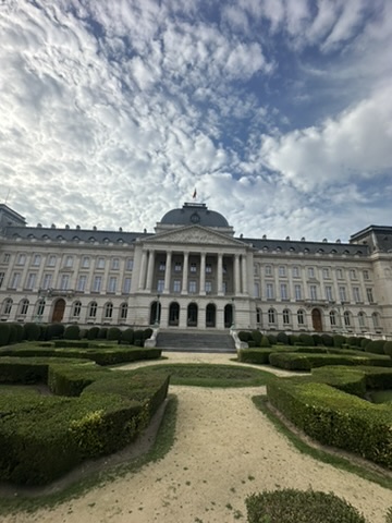 The Royal Palace of Brussels seen across the clipped box hedges