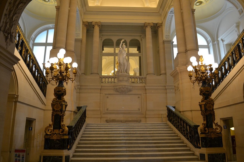 The grand marble staircase in the palace with gilded candelabra