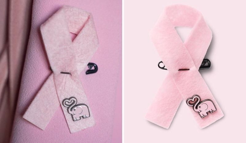 Close-up of the 2026 pink ribbon, with a small pink elephant attached at the bottom